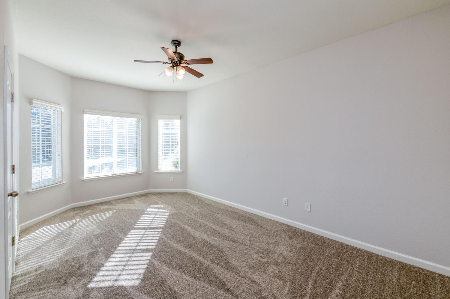 6580 East Raco Avenue Fresno, CA 93727 - Photo 17 of 30 a view of an empty room with a window