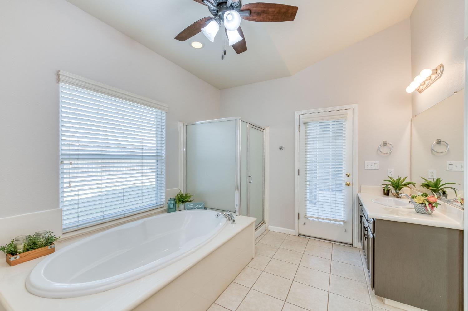 6580 East Raco Avenue Fresno, CA 93727 - Photo 22 of 30 a bathroom with a tub and a sink