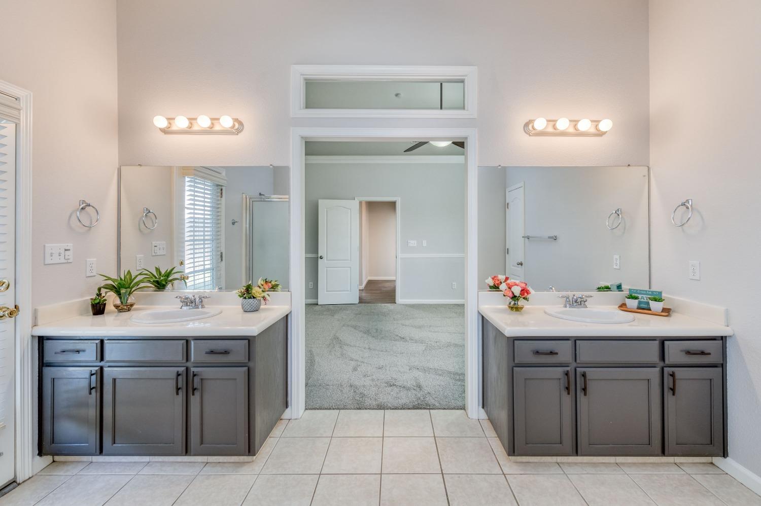 6580 East Raco Avenue Fresno, CA 93727 - Photo 23 of 30 a room with a sink and a mirror
