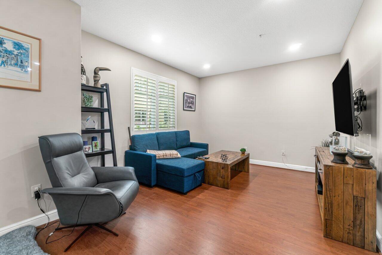 3805 Northwest 5th Terrace Boca Raton, FL 33431 - Photo 14 of 30 a living room with furniture and a flat screen tv