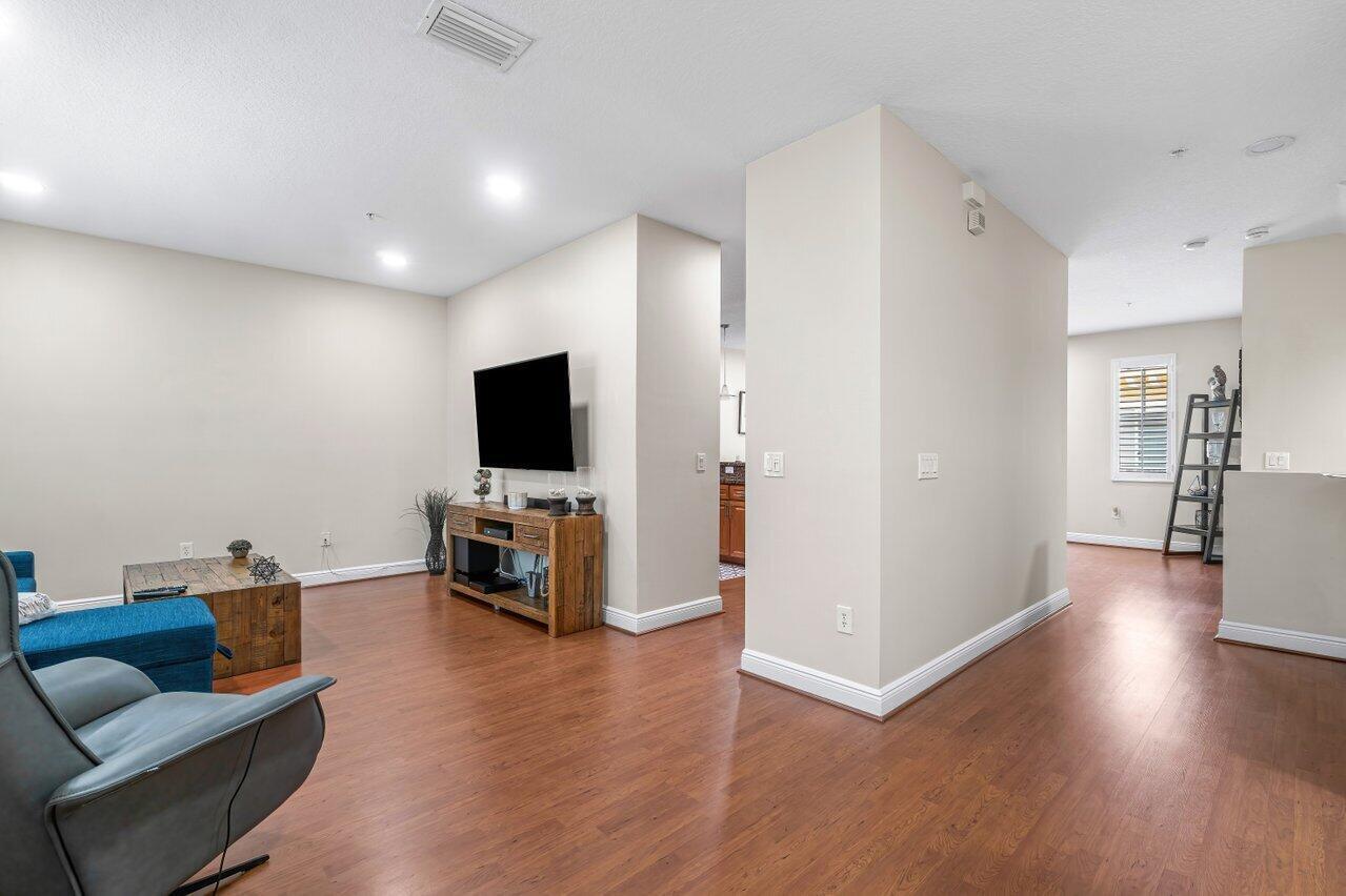 3805 Northwest 5th Terrace Boca Raton, FL 33431 - Photo 17 of 30 a living room with furniture and a flat screen tv