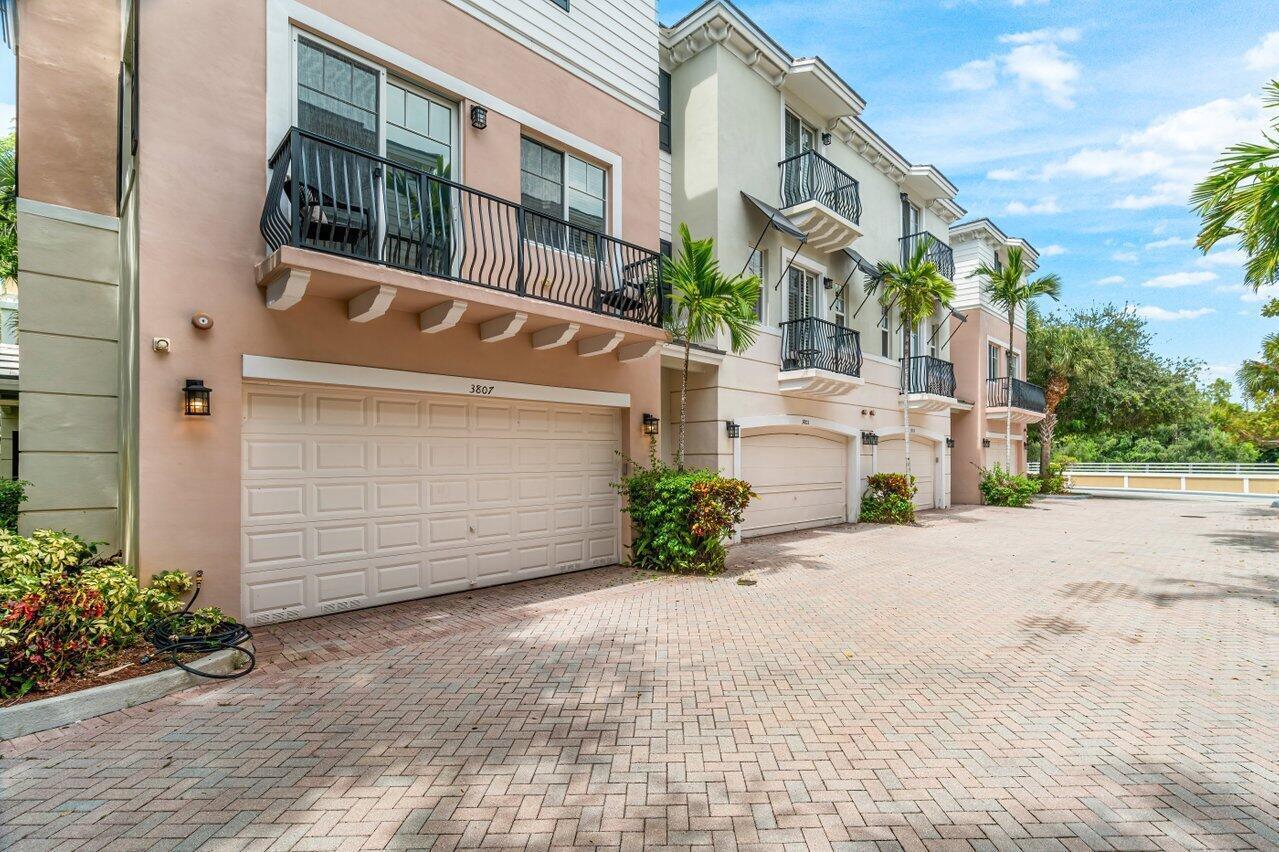 3805 Northwest 5th Terrace Boca Raton, FL 33431 - Photo 2 of 30 a front view of a building with a yard and potted plants