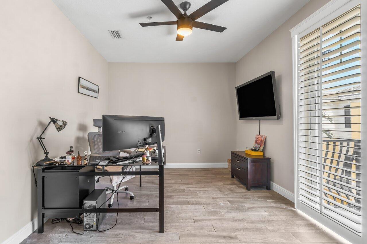 3805 Northwest 5th Terrace Boca Raton, FL 33431 - Photo 27 of 30 a view of a workspace with furniture and a window