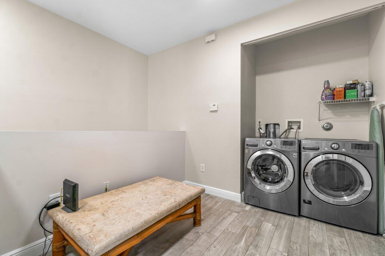 3805 Northwest 5th Terrace Boca Raton, FL 33431 - Photo 28 of 30 a utility room with dryer and washer