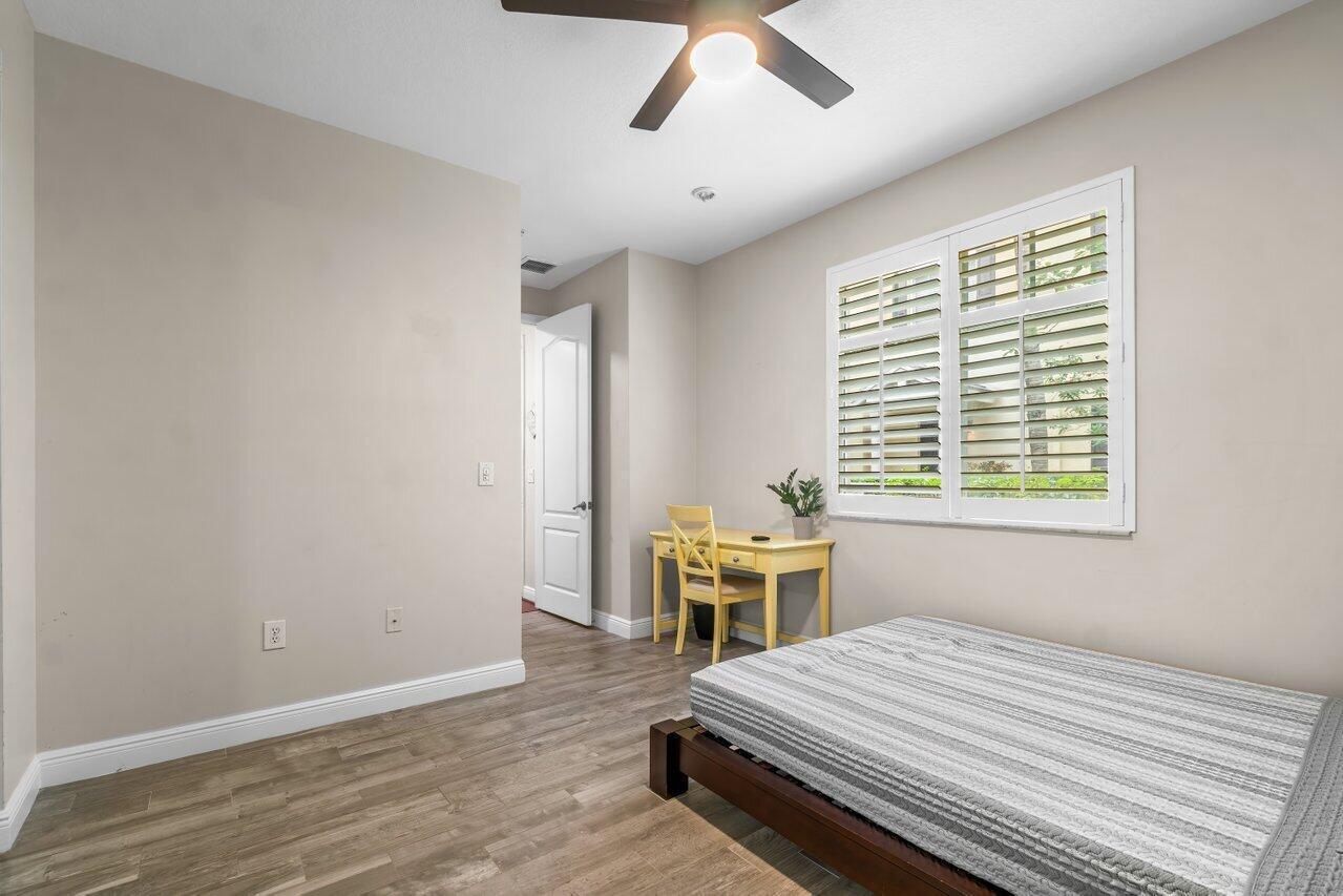 3805 Northwest 5th Terrace Boca Raton, FL 33431 - Photo 5 of 30 a bedroom with a bed and windows