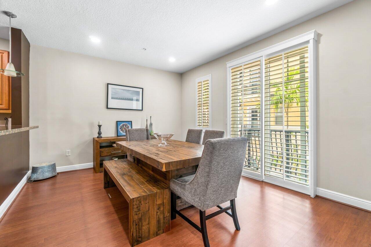 3805 Northwest 5th Terrace Boca Raton, FL 33431 - Photo 7 of 30 a view of a dining room with furniture window and wooden floor