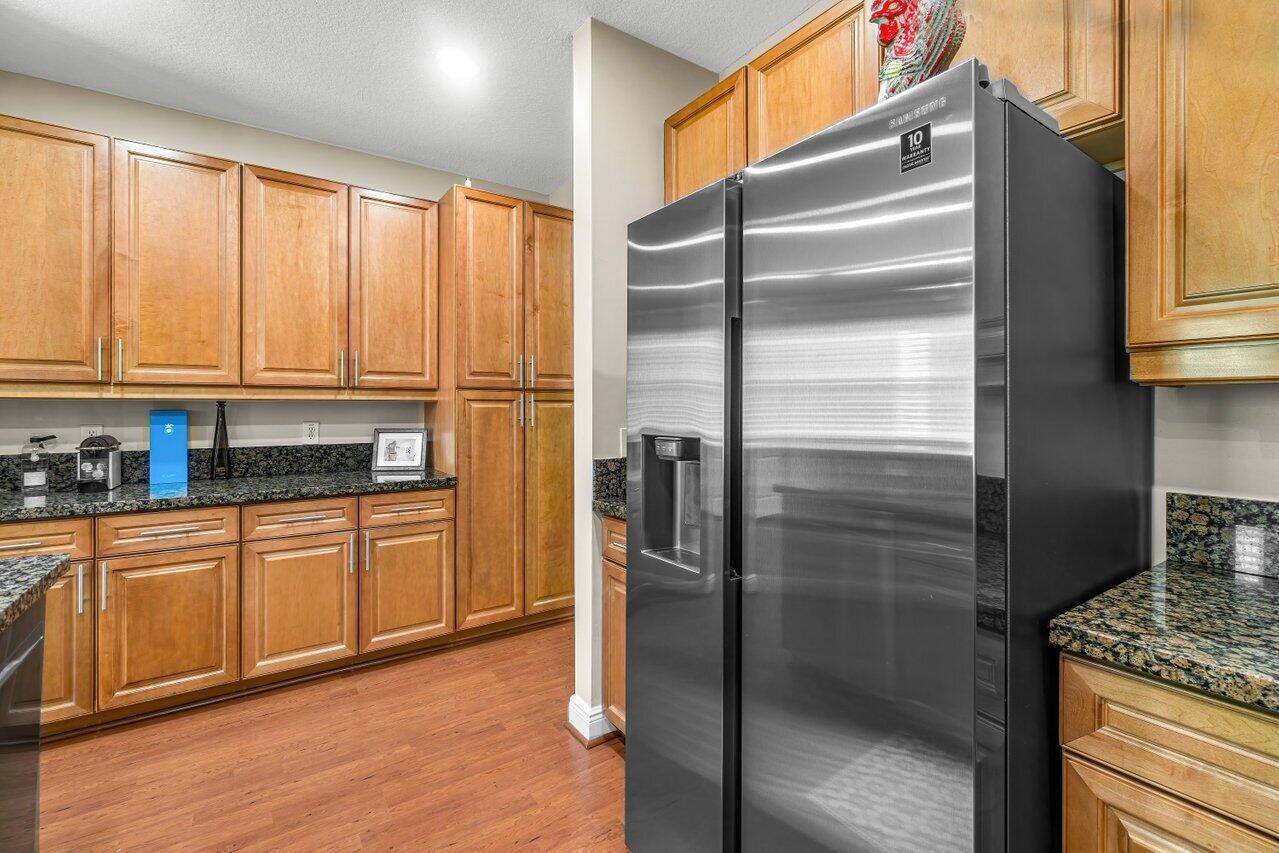 3805 Northwest 5th Terrace Boca Raton, FL 33431 - Photo 10 of 30 a kitchen with stainless steel appliances granite countertop a refrigerator and a sink