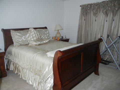 1020 Chaucer Court, Unit A Elgin, IL 60120 - Photo 10 of 10 a bedroom with a bed and a window