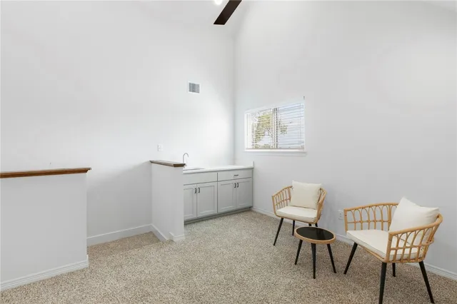 a work room with a window and furniture