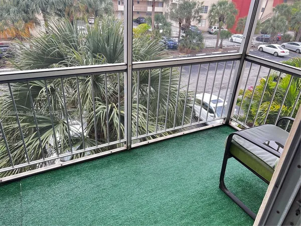 a view of a swimming pool and sitting area
