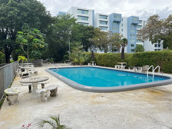 a view of a swimming pool with a patio