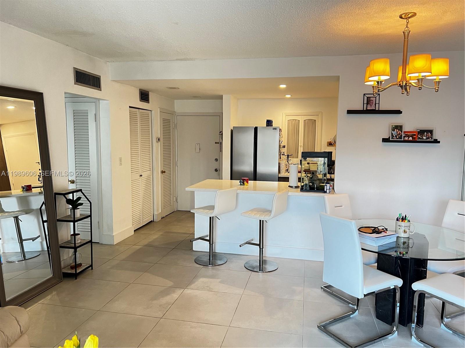 9159 Southwest 77th Avenue, Unit 311 Miami, FL 33156 - Photo 3 of 17 a view of kitchen with furniture and large windows