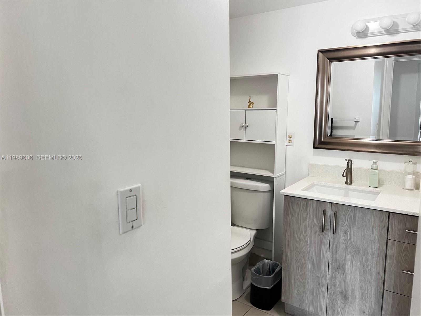 9159 Southwest 77th Avenue, Unit 311 Miami, FL 33156 - Photo 7 of 17 a bathroom with a sink and a toilet