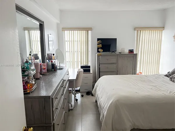 a bathroom with a shower and a sink
