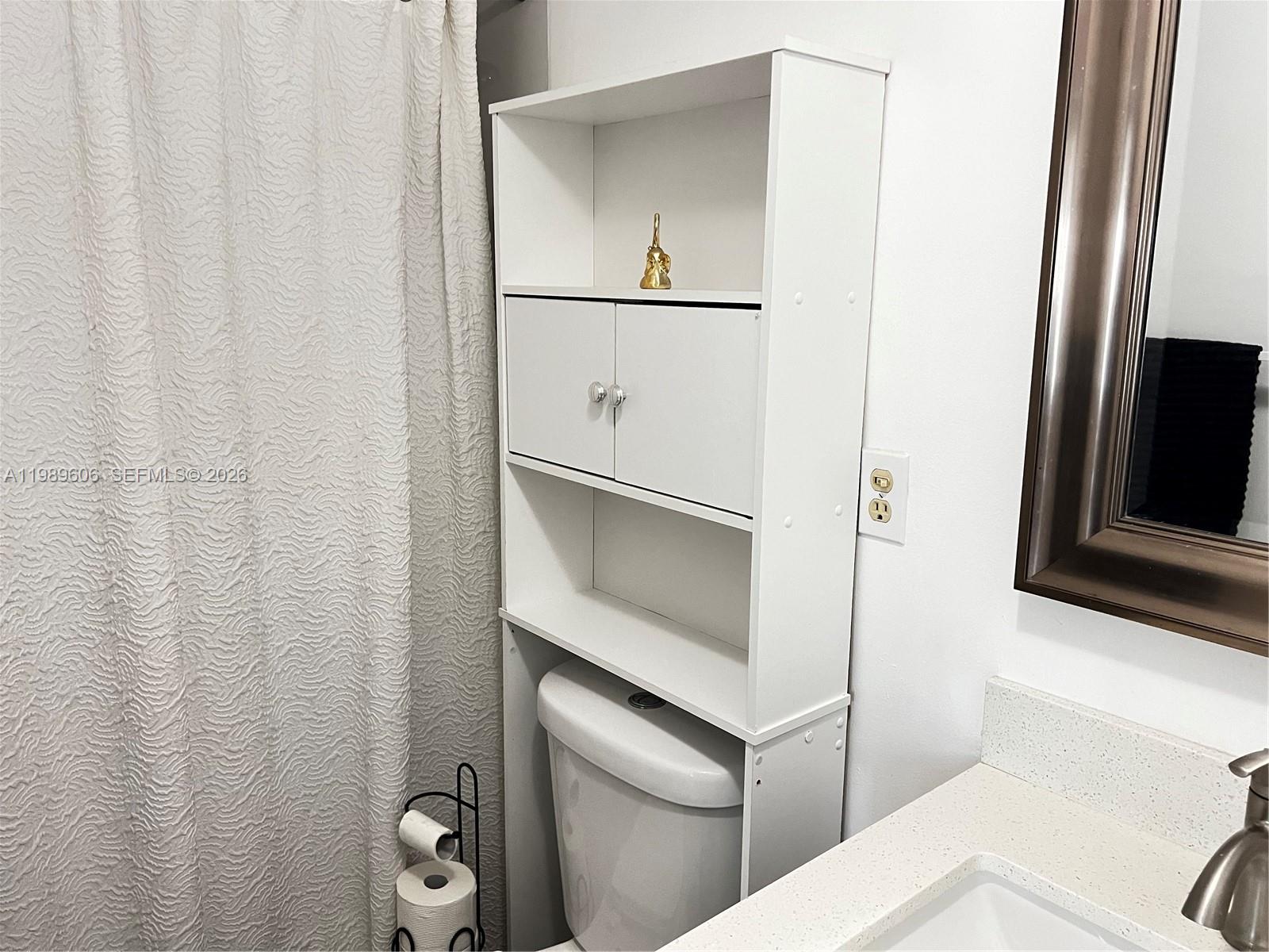 9159 Southwest 77th Avenue, Unit 311 Miami, FL 33156 - Photo 10 of 17 a bathroom with a shower and a sink