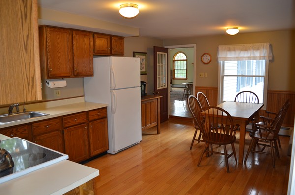 59 Shea Road West Brookfield, MA 01585 - Photo 3 of 21 a kitchen with stainless steel appliances granite countertop a dining table chairs refrigerator sink and cabinets