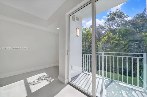a view of a balcony with wooden floor