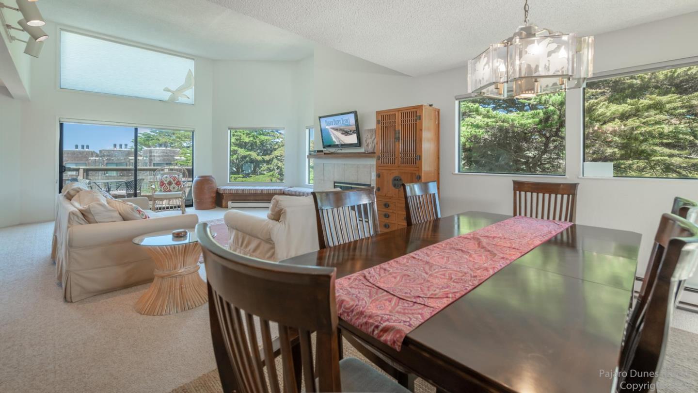 101 Shell Road, Unit 102 Watsonville, CA 95076 - Photo 11 of 20 a view of a dining room with furniture large windows and wooden floor