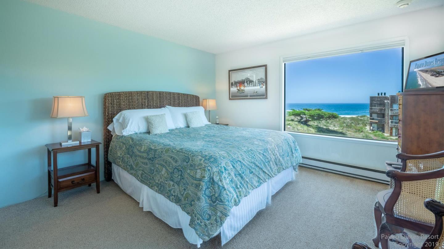 101 Shell Road, Unit 102 Watsonville, CA 95076 - Photo 12 of 20 a bedroom with a bed and a flat screen tv