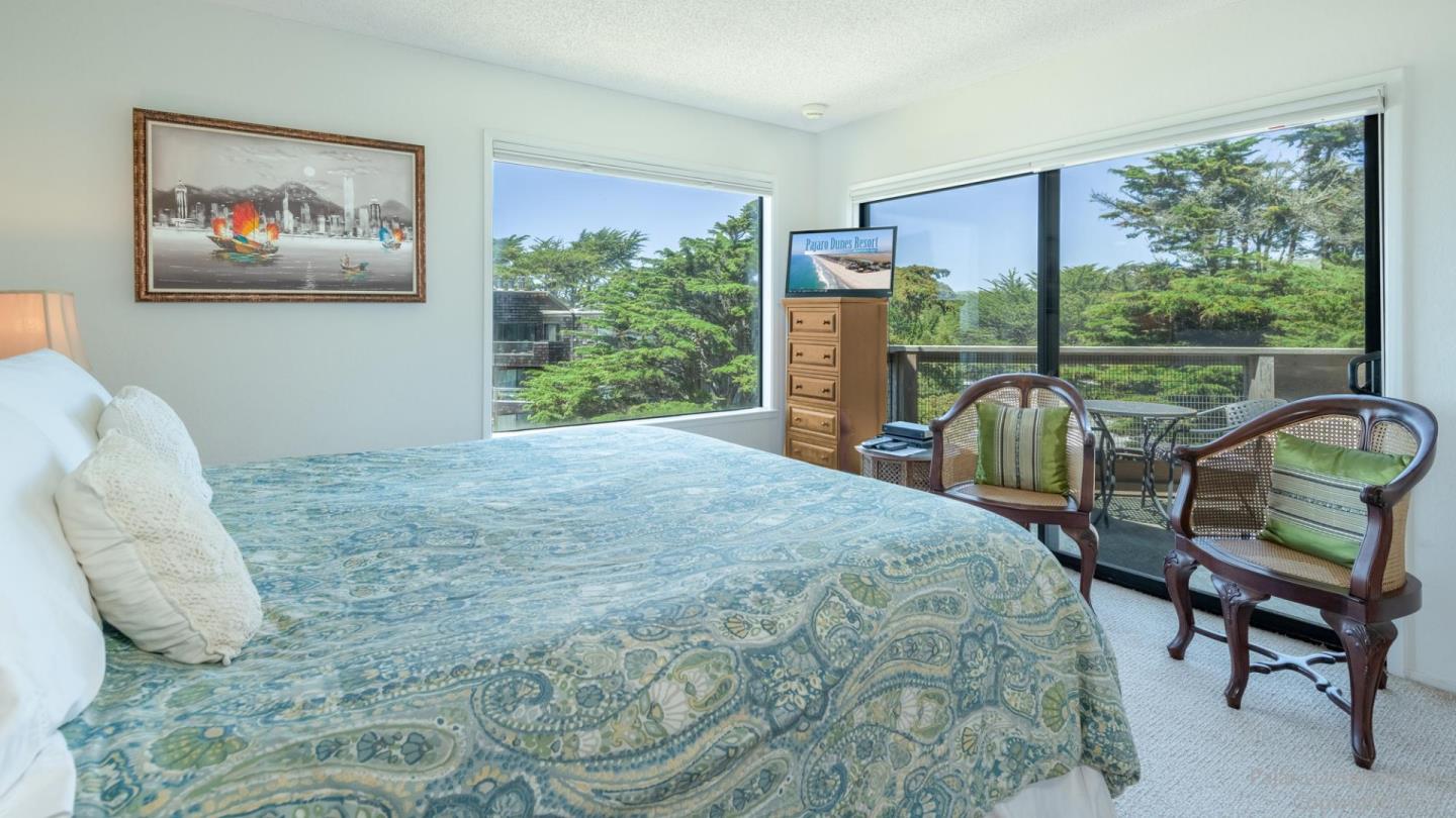 101 Shell Road, Unit 102 Watsonville, CA 95076 - Photo 13 of 20 a bed sitting in a bedroom next to a window