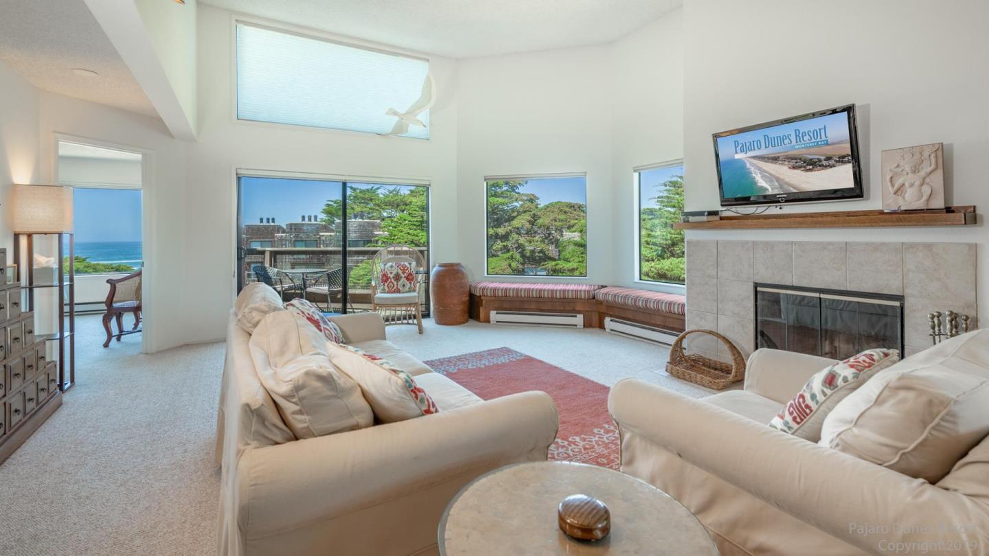 101 Shell Road, Unit 102 Watsonville, CA 95076 - Photo 2 of 20 a living room with furniture and a fireplace