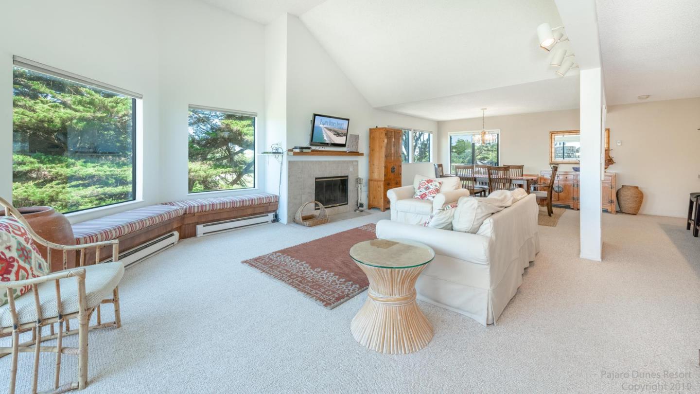 101 Shell Road, Unit 102 Watsonville, CA 95076 - Photo 4 of 20 a living room with furniture and a fireplace