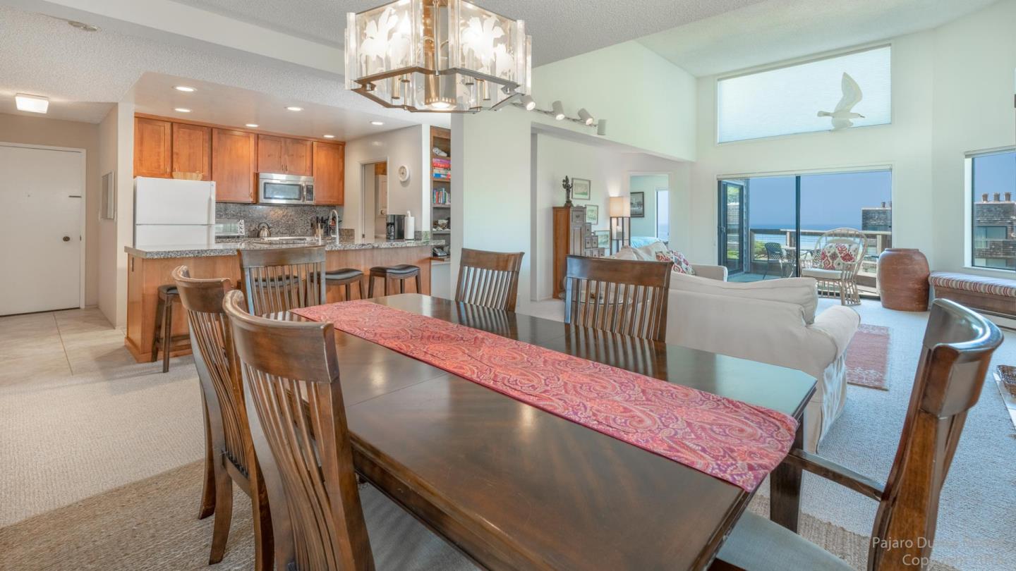 101 Shell Road, Unit 102 Watsonville, CA 95076 - Photo 10 of 20 a view of a dining room and livingroom with furniture a chandelier