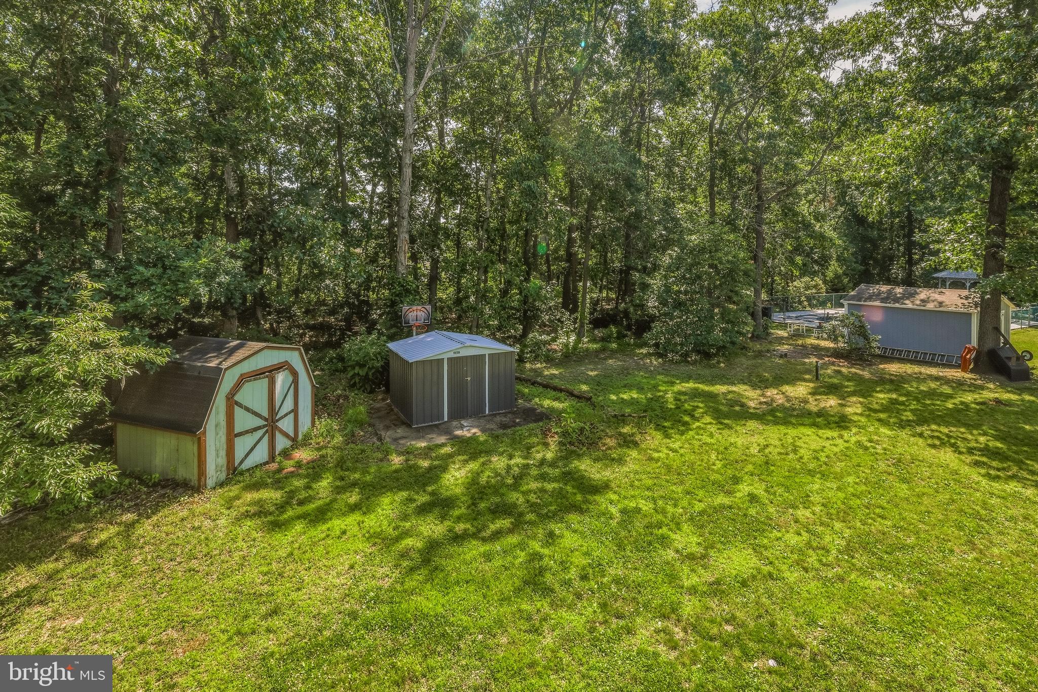7 Matro Avenue Sicklerville, NJ 08081 - Photo 20 of 21 a view of a backyard with table and chairs and iron fence
