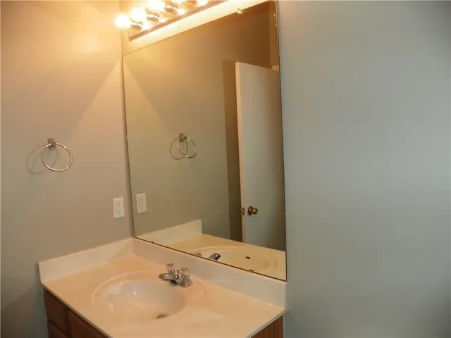 a bathroom with a sink and shower