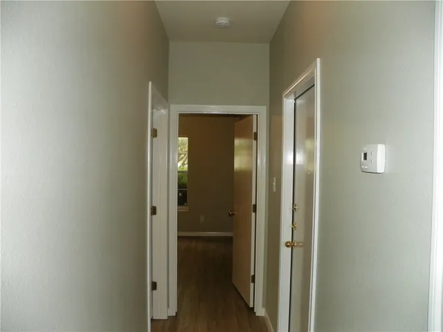 a view of a bathroom from a hallway