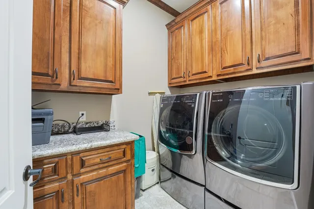 a kitchen with stainless steel appliances granite countertop a refrigerator and stove