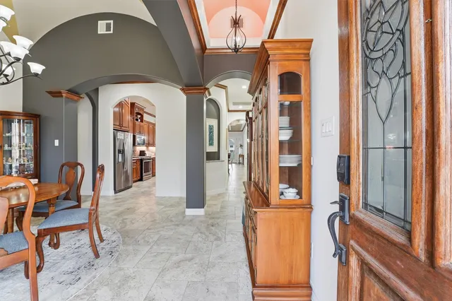 a front view of a house with outdoor seating