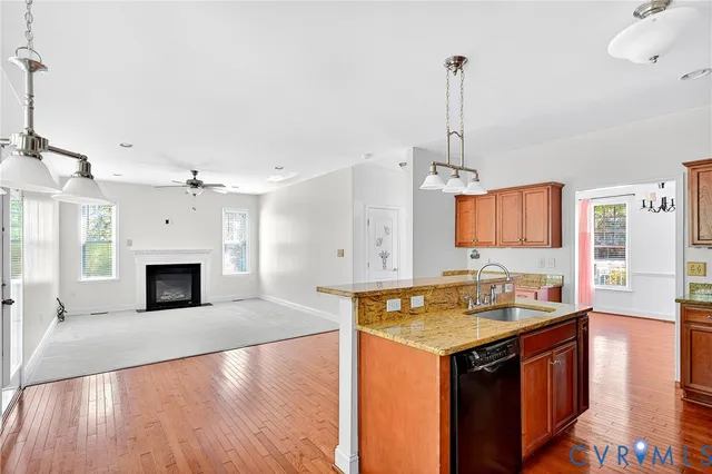 a kitchen with sink cabinets and fireplace