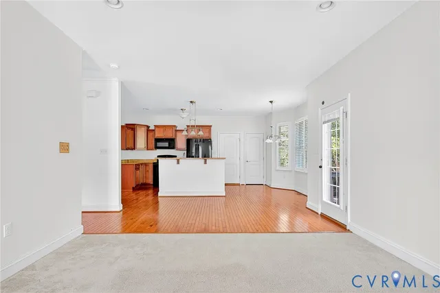 a view of kitchen with furniture and wooden floor