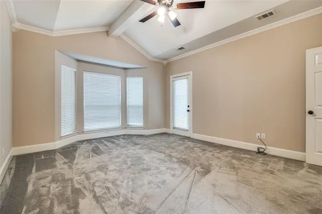 a kitchen with granite countertop white cabinets stainless steel appliances a sink and a window