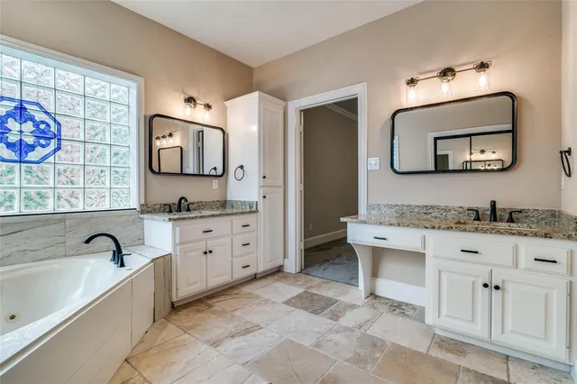 a view of an empty room with a chandelier fan