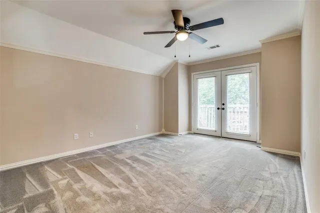 a bathroom with a granite countertop toilet sink and mirror
