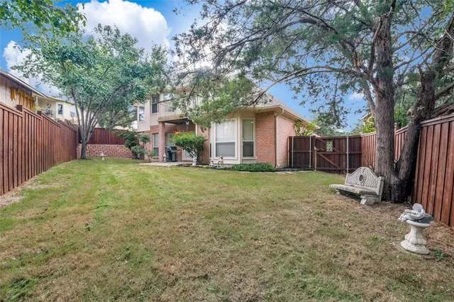 an empty room with a ceiling fan and a window