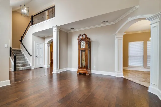a view of an entryway with wooden floor