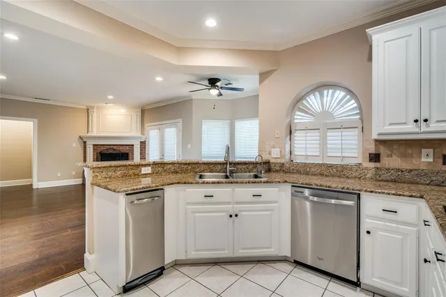 a view of a house with a yard and sitting area