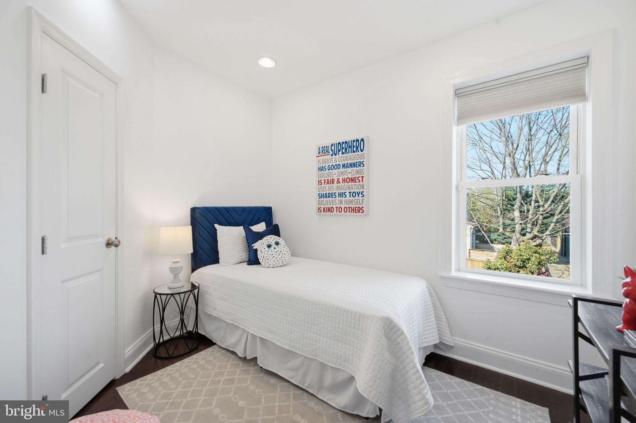 524 7th Street Northeast Washington, DC 20002 - Photo 12 of 25 a bedroom with a bed and a window