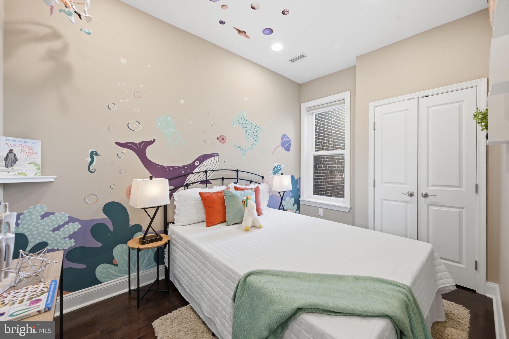 524 7th Street Northeast Washington, DC 20002 - Photo 14 of 25 a bedroom with a bed and window