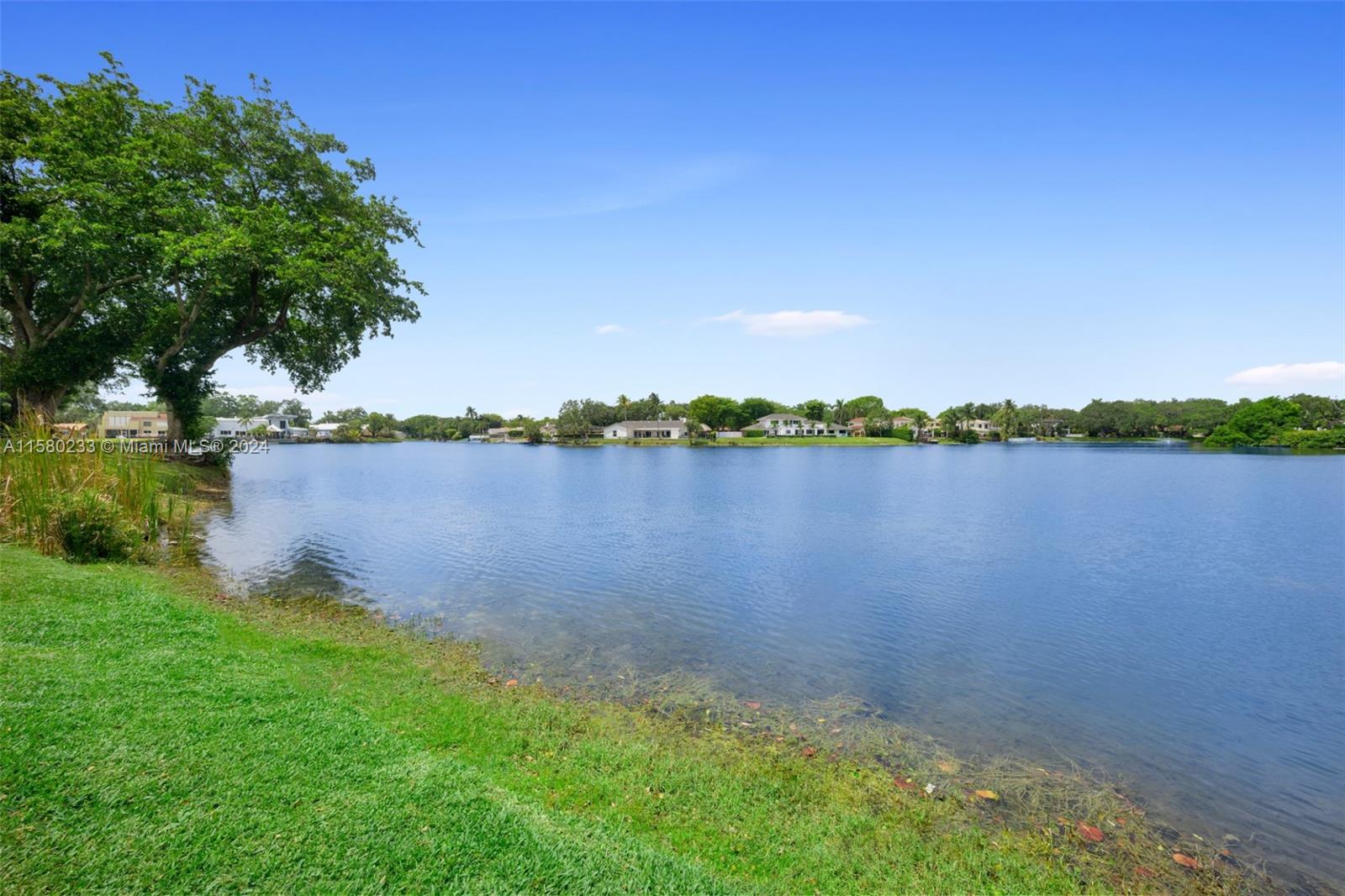 Emerald Hills Hollywood, FL 33021 - Photo 1 of 25 a view of a lake with houses in the back