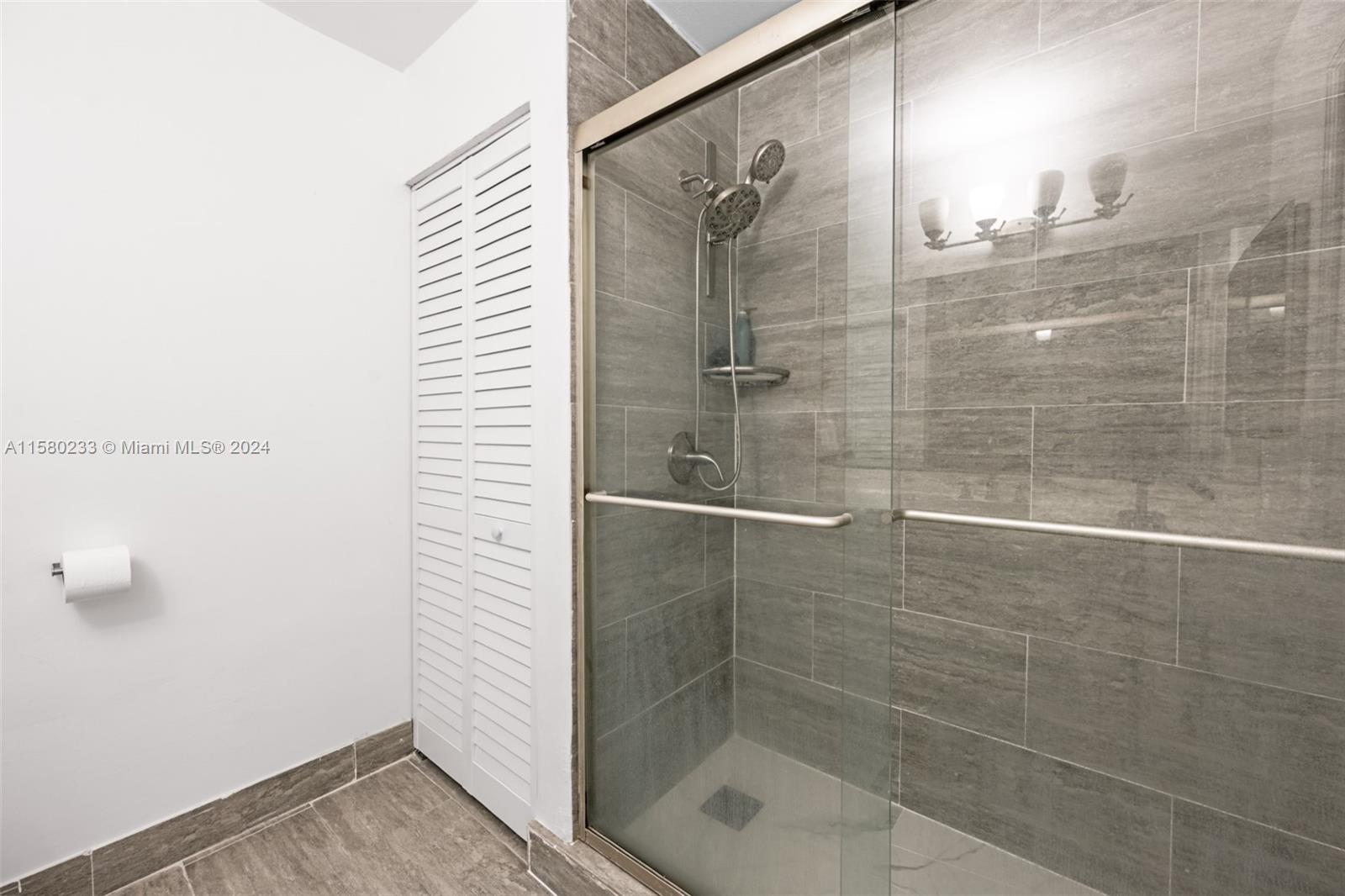 Emerald Hills Hollywood, FL 33021 - Photo 14 of 25 a bathroom with a shower