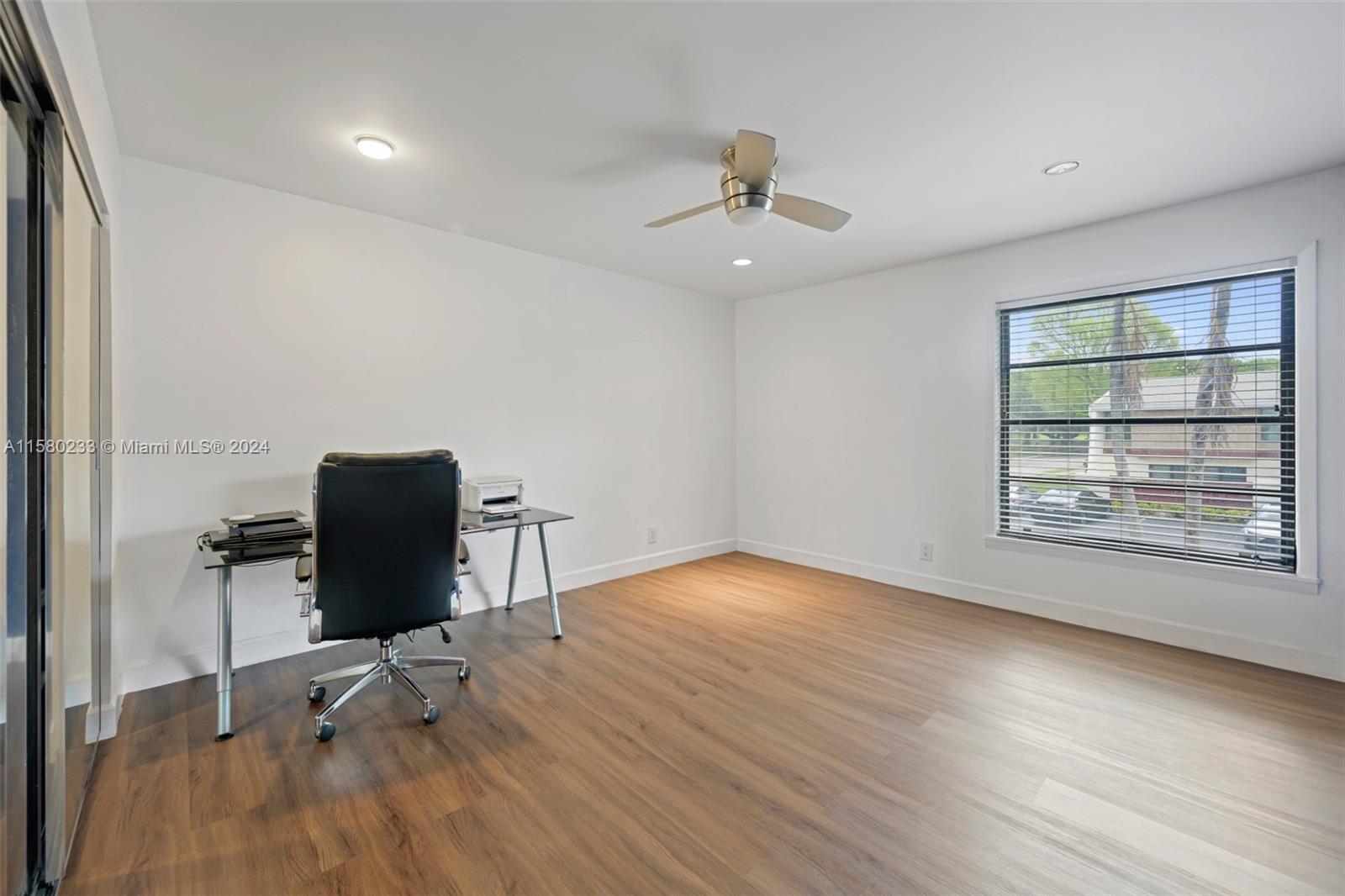 Emerald Hills Hollywood, FL 33021 - Photo 17 of 25 a view of a workspace with furniture and a window