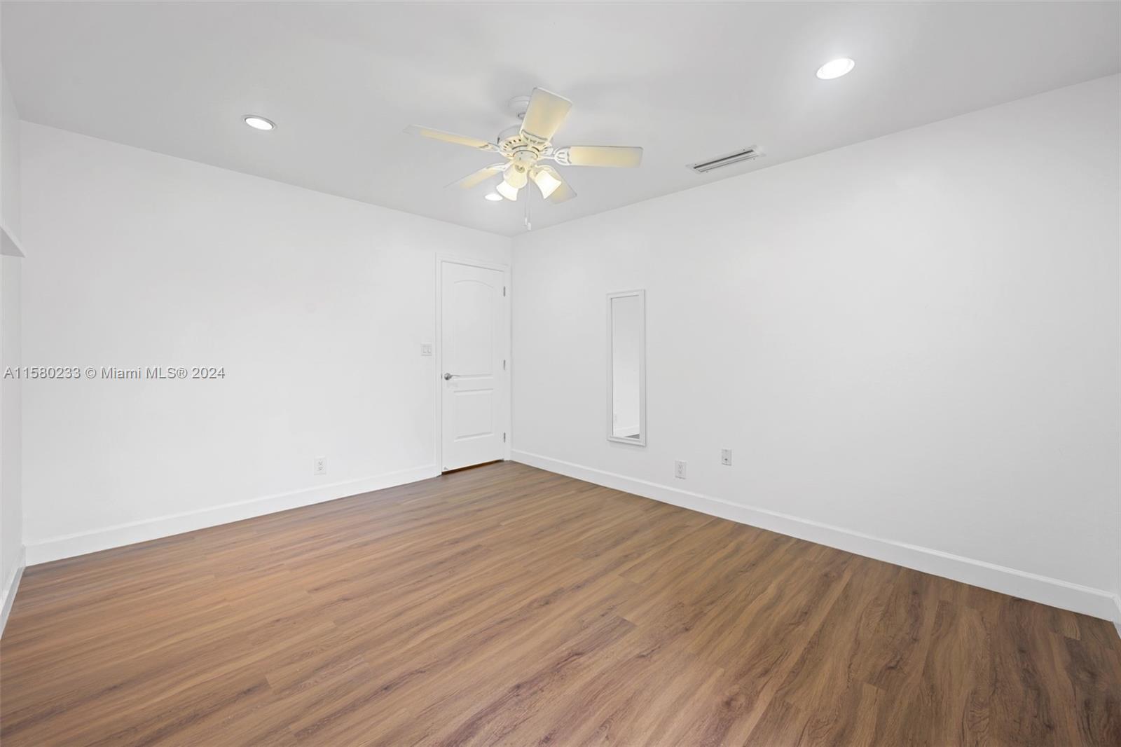 Emerald Hills Hollywood, FL 33021 - Photo 19 of 25 a view of an empty room with wooden floor
