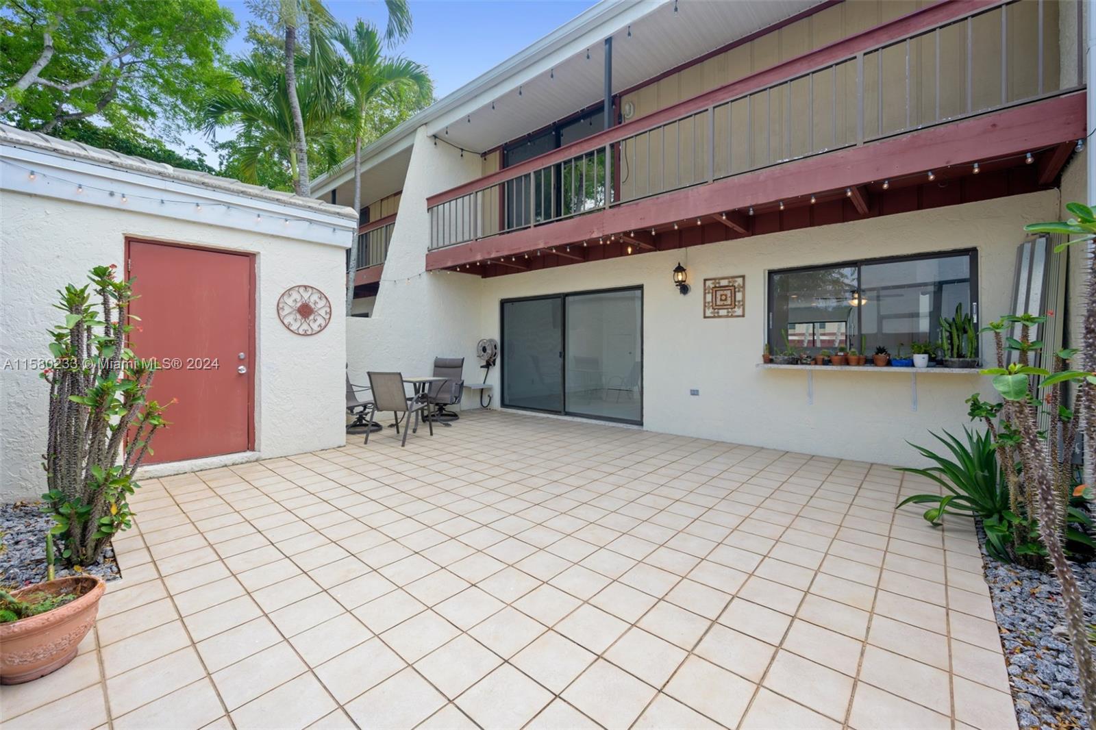 Emerald Hills Hollywood, FL 33021 - Photo 23 of 25 a front view of a building with potted plants