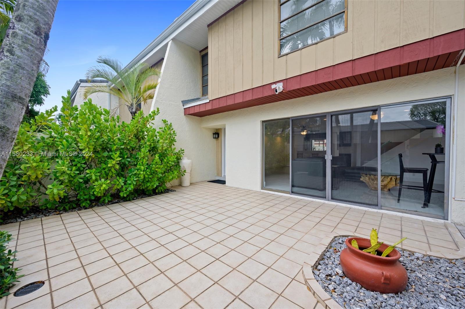 Emerald Hills Hollywood, FL 33021 - Photo 3 of 25 a backyard of a house with seating space