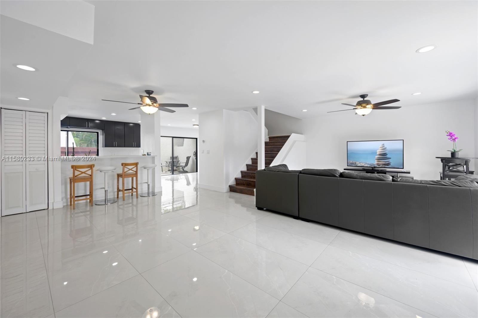 Emerald Hills Hollywood, FL 33021 - Photo 4 of 25 a living room with furniture and a flat screen tv