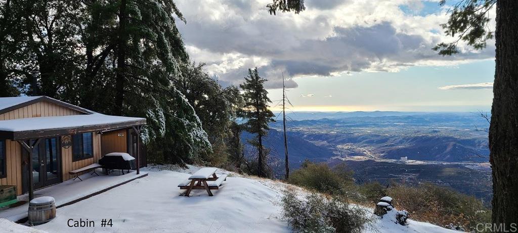 a view of a patio with chair and tables